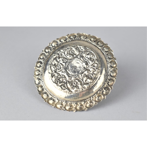 387 - An Islamic White Metal Dish with Floral Repousse Decoration, 8.5cm Diameter