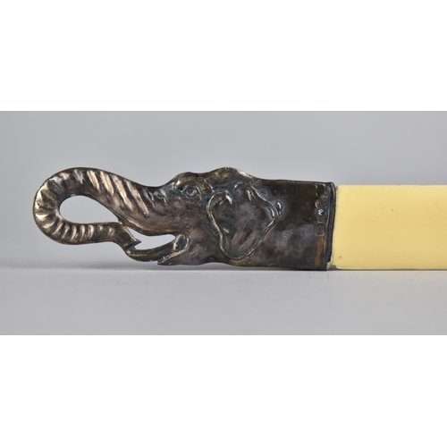 390 - A Reproduction Bone and Silver Page Turner with Elephant Head Handle, 26.5cm long