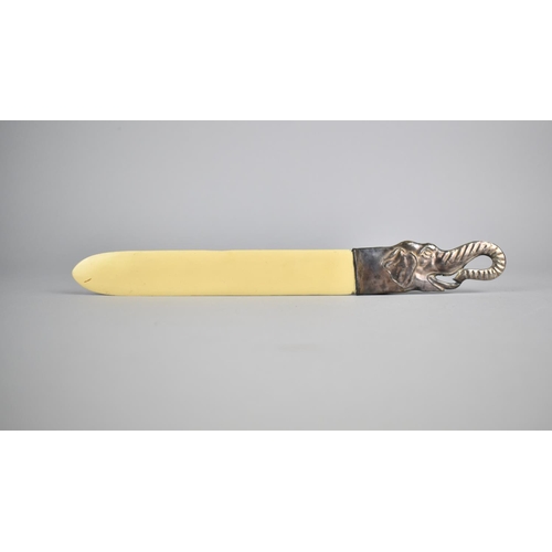 390 - A Reproduction Bone and Silver Page Turner with Elephant Head Handle, 26.5cm long