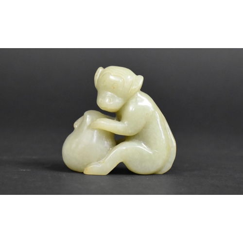 449 - A Reproduction Chinese Jade Carving of a Monkey