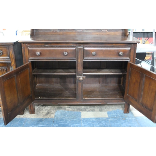 500 - A Mid 20th Century Ercol Dresser with Panelled Cupboard Two Door Base Surmounted by Two Drawers