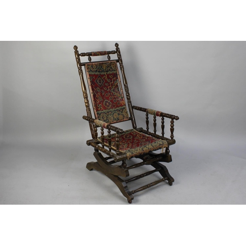 508 - A Late Victorian Mahogany Spindle Framed American Rocking Chair with Tapestry Seat and Back, in Need... 