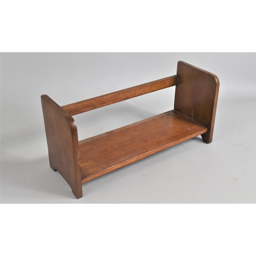 71 - An Edwardian Mahogany Book Stand, 44cms Wide