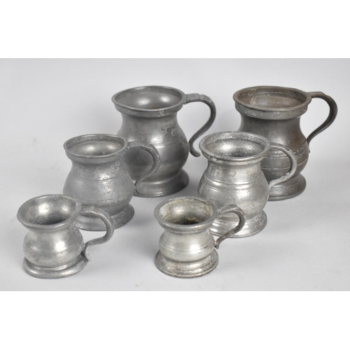 101 - Two Sets of Three Graduated Pewter Measures