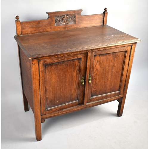 418 - An Early 20th Oak Washstand with a Carved Gallery Back, Panelled Cupboard Base on Square Supports, 9... 