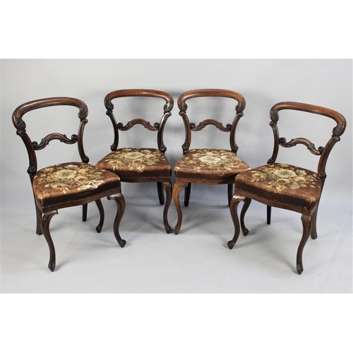 426 - A Set of Four Victorian Mahogany Balloon Back Dining Chairs with Upholstered Floral Patterned Seats