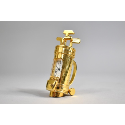 10 - A Modern Miniature Brass Novelty Desk Top Clock in the Form of a Bag of Golf Clubs, 7cms High