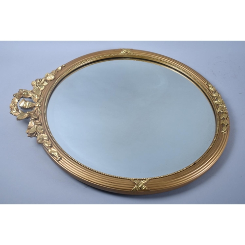 118 - A Mid 20th Century Circular Gilt Framed Wall Mirror with Wreath and Swag Gilded Decoration, 45cms Di... 