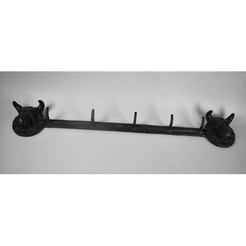 119 - A Modern Cast Iron Wall Mounting Five Hook Coat Rail, Supports in the form of Bull masks, 75cms Wide