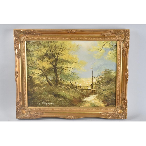 129 - A Gilt Framed Oil on Canvas Depicting Stile on Country Lane, Signed V Stephens, 39x30cms