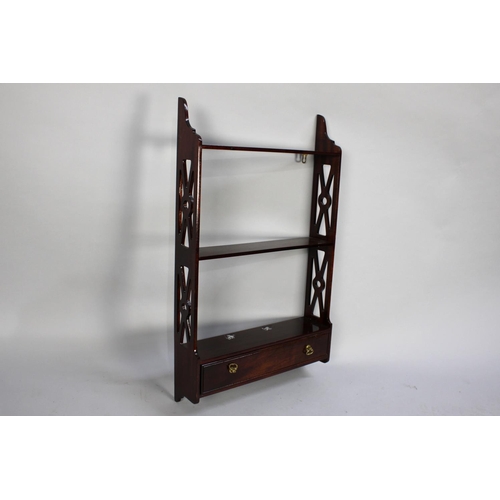 134 - A Modern Mahogany Wall Hanging Shelf Unit with Pierced Supports and Single Base Drawer, 41cms Wide a... 