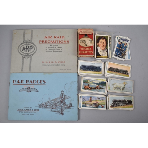 136 - A Small Collection of Loose Cigarette Cards, together with two albums, RAF Badges and Air Raid Preca... 