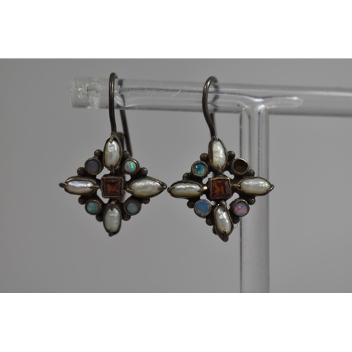 385 - A Pair of Silver Clip on Earrings with Opals and Seed Pearls Having Central Faceted Stone, One Stone... 