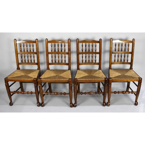 476 - A Set of Four Rush Seated Spindle Back Dining Chairs