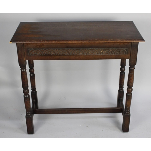 493 - A Mid 20th Century Oak Rectangular Side Table with Single Long End to End Drawer, Carved Front Rail ... 