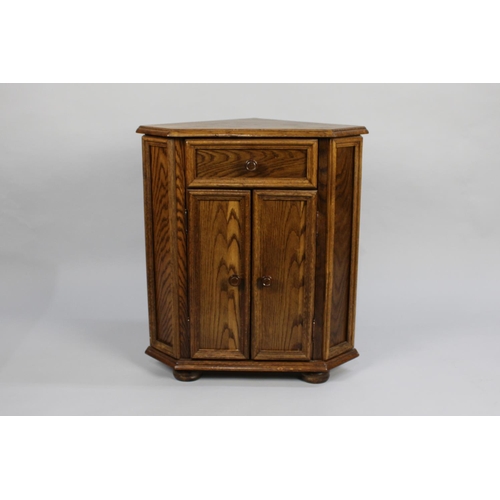 504 - An Oak Wall Hanging Corner Cabinet with Panelled Door to Shaped Inner Shelves, 70cms Wide and 99cms ... 