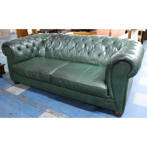 506 - A Large Two Seater Green Leather Effect Button Back Chesterfield Settee