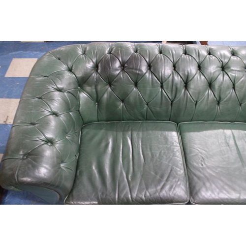 506 - A Large Two Seater Green Leather Effect Button Back Chesterfield Settee