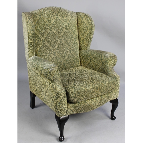 510 - An Upholstered Wing Armchair