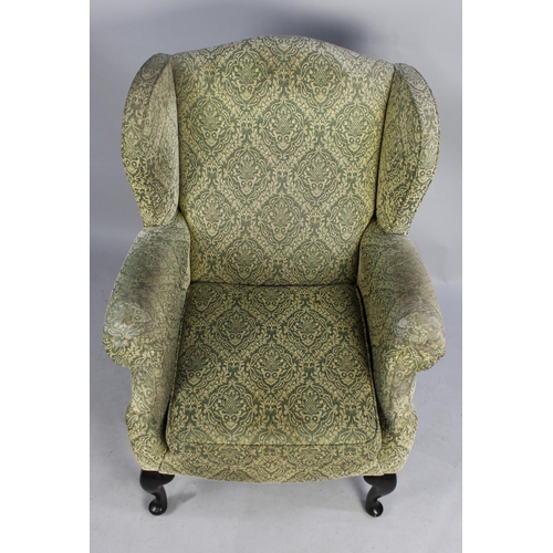 510 - An Upholstered Wing Armchair