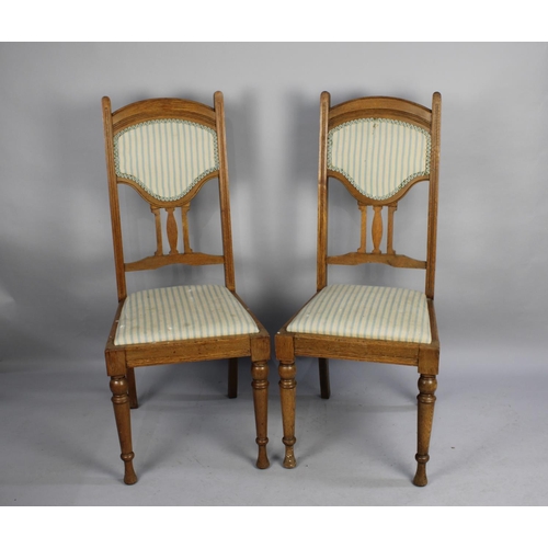 513 - A Pair of Oak Framed and Upholstered Seated and Backed Chairs