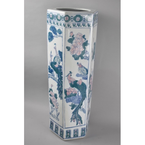 63 - An Oriental Hexagonal Ceramic Stick Stand Decorated with Exotic Birds and Flowers, 63cms High