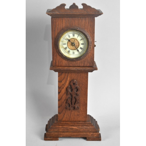 71 - An Edwardian Novelty Mantel Clock in the Form of a Miniature Oak Long Case Clock with Removable Cloc... 