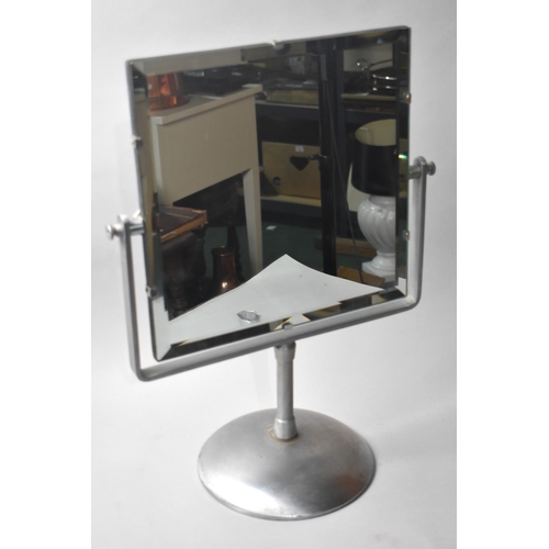 77 - A Mid 20th Century Heavy Metal Framed Bevel Edged Swing Bathroom Mirror, 49cms High and 37cms Wide