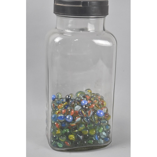 79 - A Vintage Glass Sweet Jar Containing Marbles