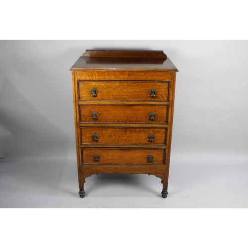 80 - An Edwardian Oak Four Drawer Chest, 73cms Wide and 107cms High