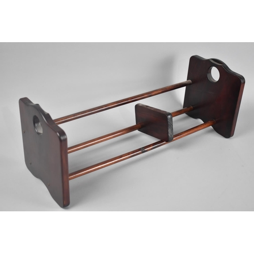 90 - A Modern Mahogany Book Rack with Slide