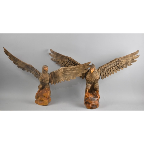 107 - A Pair of Carved Wooden Eagles with Wings Outstretched, Largest 62cms Wingspan