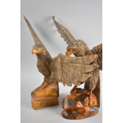 107 - A Pair of Carved Wooden Eagles with Wings Outstretched, Largest 62cms Wingspan