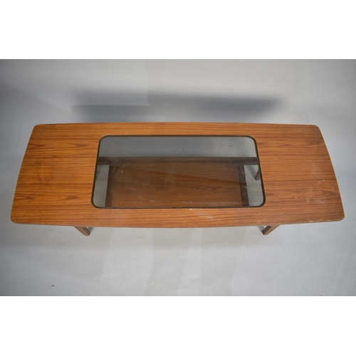 114 - A 1970s Glass Top Teak Effect Coffee Table of Rectangular Form, 134cms Wide