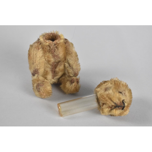 16 - A Small Schuko Jointed Teddy Bear with Removable Head Revealing Cylindrical Glass Flask, 12cms High