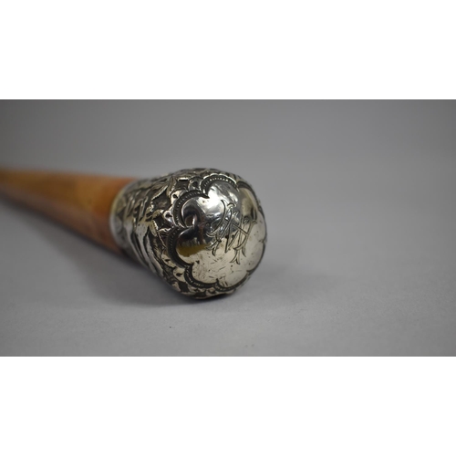 29 - A Colonial Malacca Walking Cane with White Metal Top Decorated with Palm Trees and Hunting Dogs