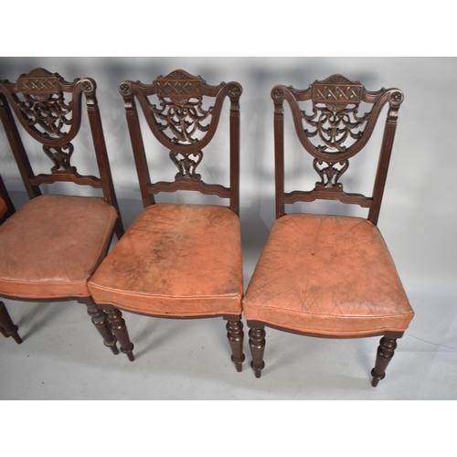 450 - A Set of Four Late Victorian/Edwardian Mahogany Framed Dining Chairs with Carved Backs