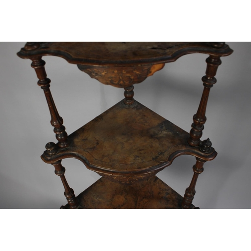 49 - A Late Victorian Four Tier Walnut Veneered Whatnot with Turned Supports and Shaped Shells having Inl... 