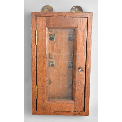 52 - An Early/ Mid Wooden Wall Hanging Key Box with Glazed Hinged Door having Lock and Key to Six Hook In... 