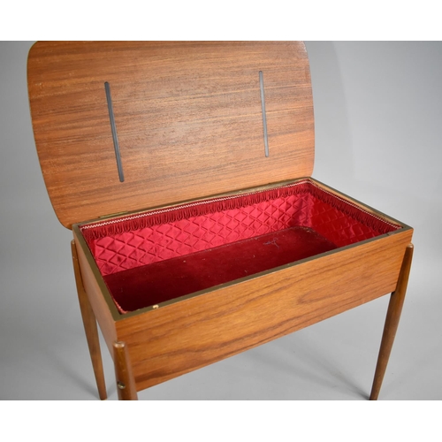 72 - A 1970s Teak Lift Top Rectangular Sewing Box on Turned Supports, 57cms Wide