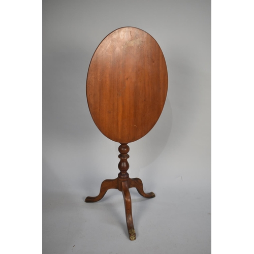 95 - An Edwardian Mahogany Oval Snap Top Tripod Table with Bobbin Supports, 57cms High