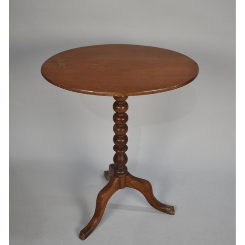 95 - An Edwardian Mahogany Oval Snap Top Tripod Table with Bobbin Supports, 57cms High