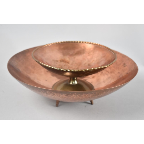 101 - A Circular hand Beaten Four Legged Copper Bowl, 28cms Diameter together with a Hand Beaten Arts and ... 