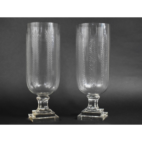 104 - A Pair of Tall Glass Hurricane Lamps, 44cms High