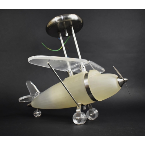 113 - A Modern Glass and Perspex Ceiling Light Fitting in the Form of an Aeroplane, 37cms High