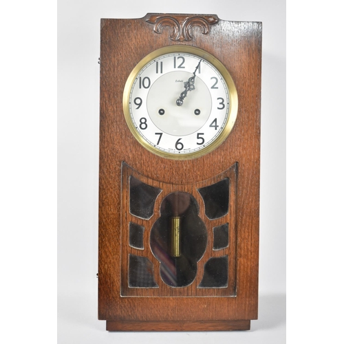 115 - An Art Deco Oak Cased Wall Clock by Enfield with Cylindrical Brass Pendulum, Working Order