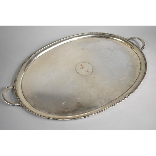 117 - A Large Edwardian Silver Plated Oval Drinks Tray with Two Handles and Rope Border, 70cms Wide