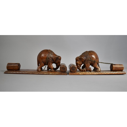 144 - A Pair of Carved Wooden Indian Book Ends in the Form of Elephants Pushing Tree Trunk Whilst Dragging... 