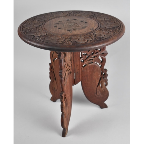 166 - A Carved Circular Topped Indian Occasional Table with Folding Triform Base, 38cms Diameter, missing ... 