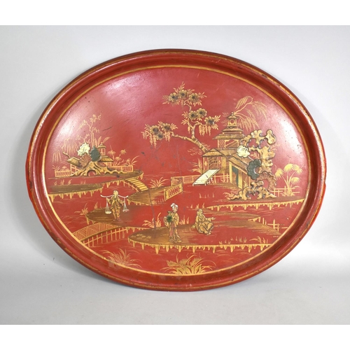 202 - A Large Papier Mache Chinoiserie Tray decorated with Figures, Pagoda etc, 75cms by 20cms